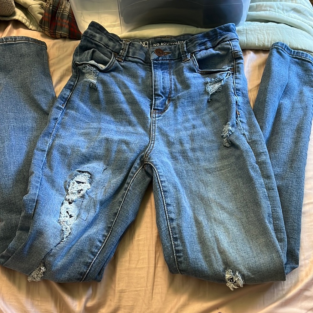 Distressed denim jeans